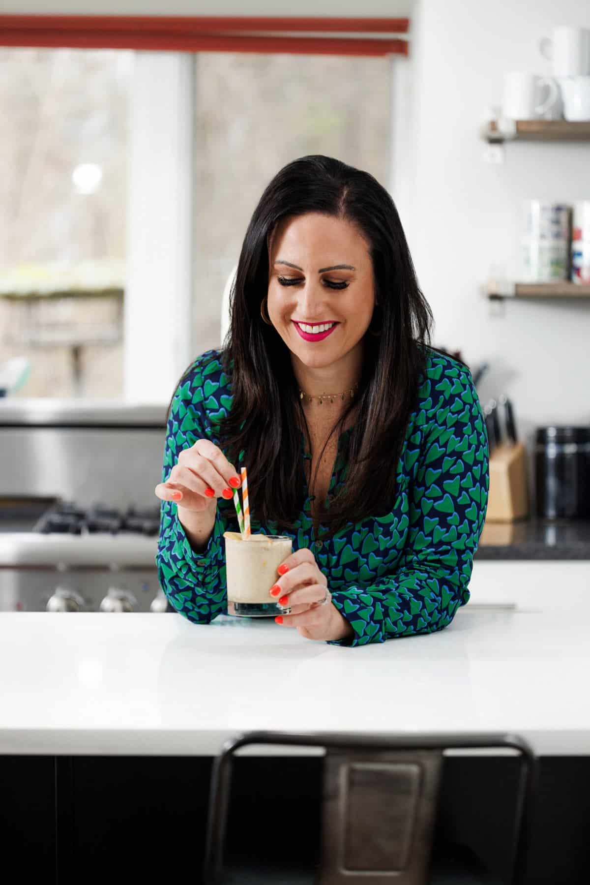 Liz Drinking apple peanut butter smoothie.
