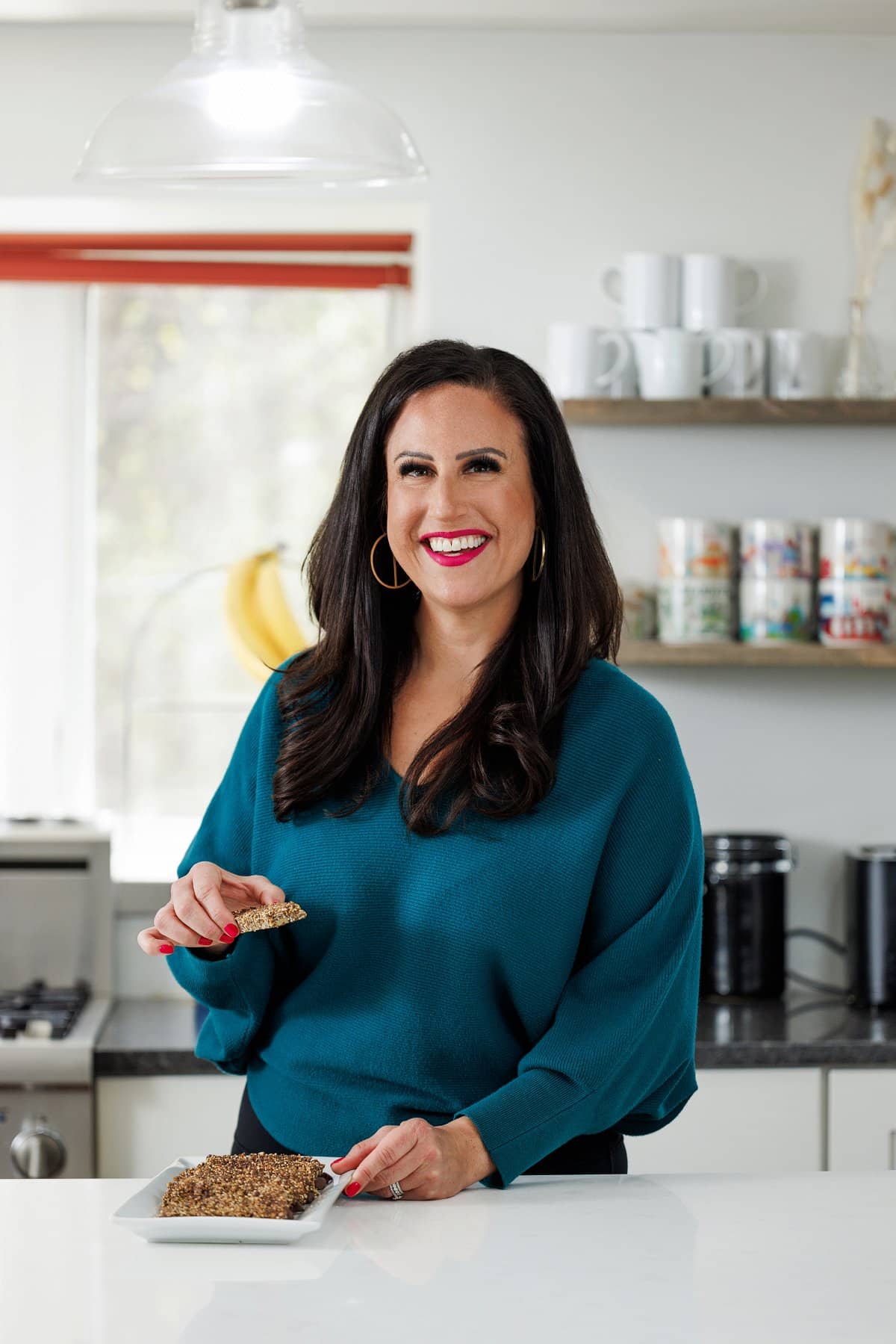 Liz eating quinoa chocolate chip granola bars.