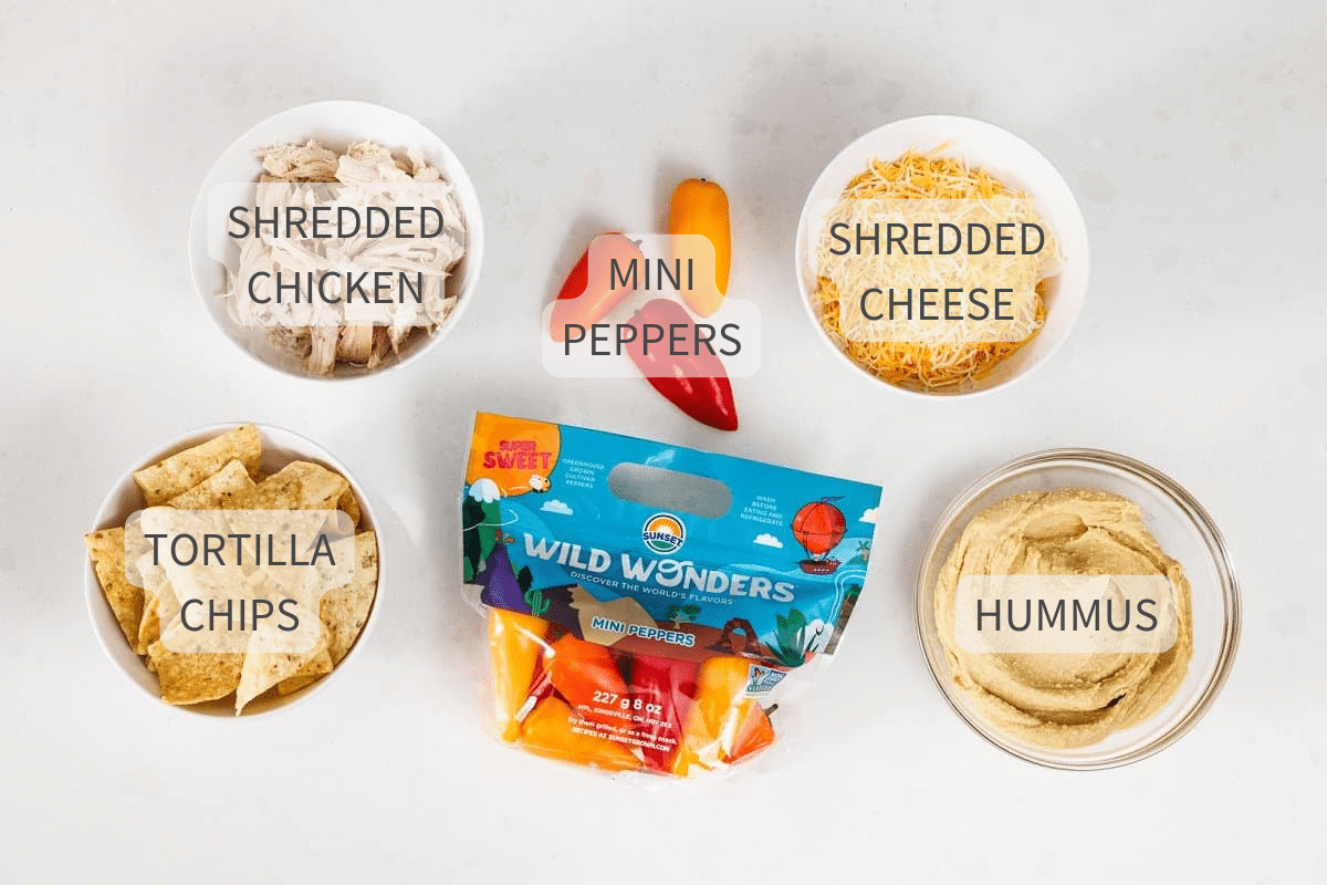 Ingredients for protein packed baked hummus on a white background, labeled.