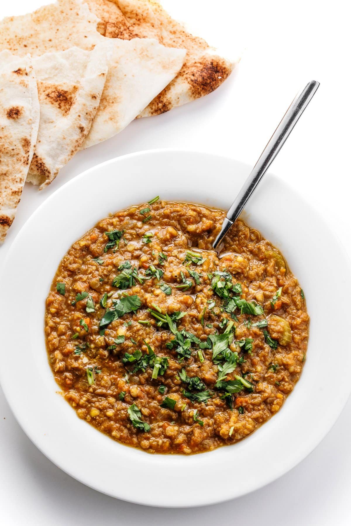 Blended Arabic lentil soup in a large white bowl.