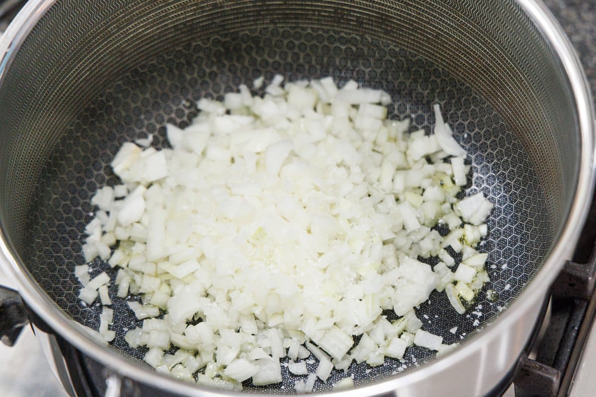 Diced onion in the bottom of a large stock pot.