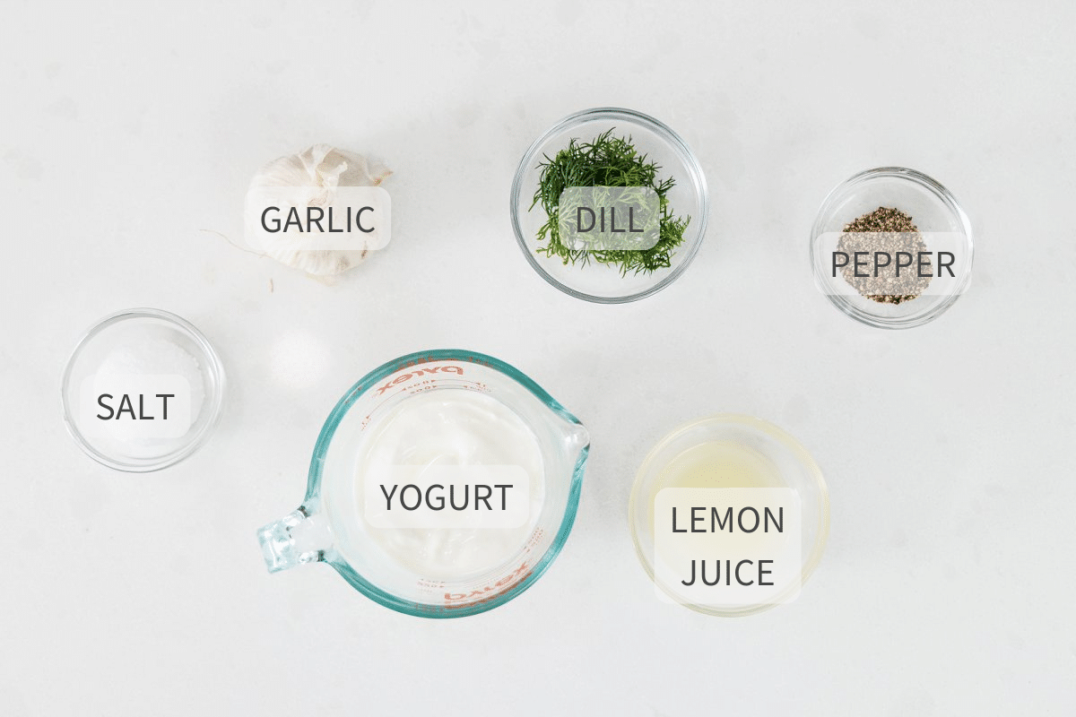 Labeled ingredients for 5-ingredient dill ranch dressing on a white counter.