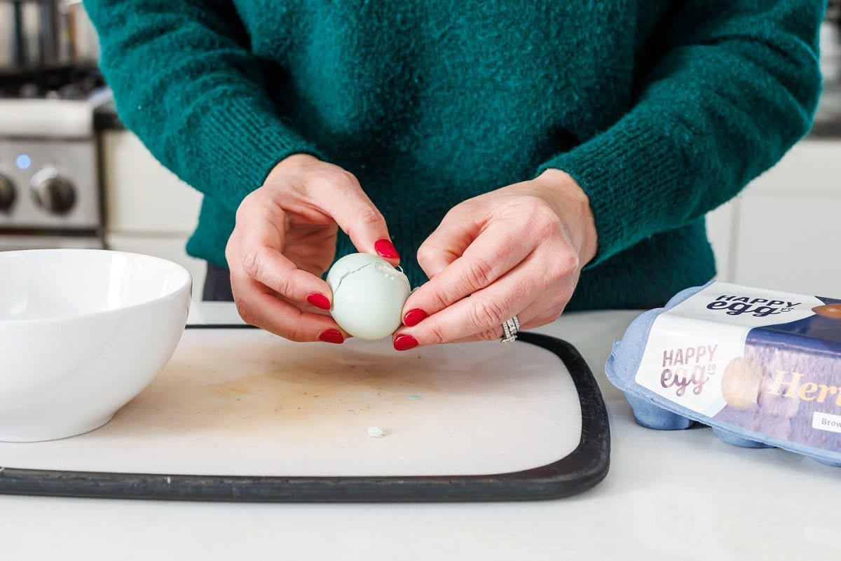 Liz peeling an egg.
