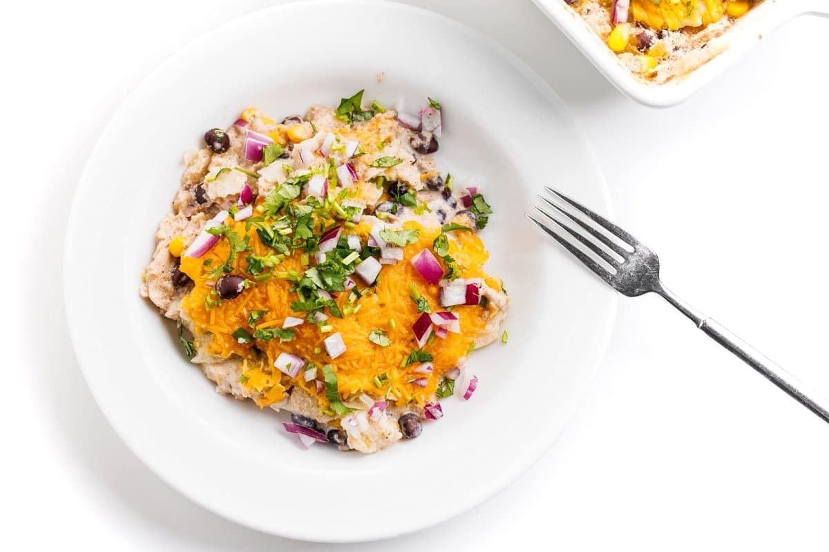 Mexican lasagna o a white plate.