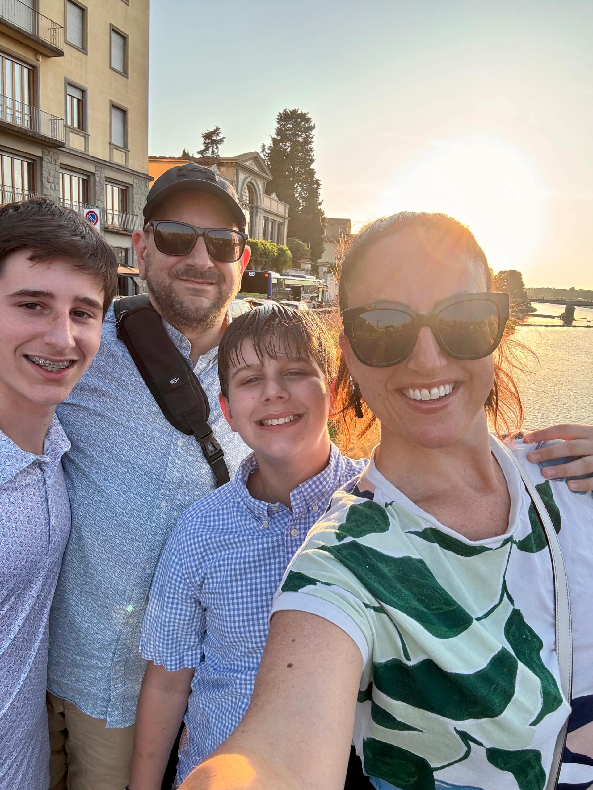 Liz's family smiling on the streets of Florence.