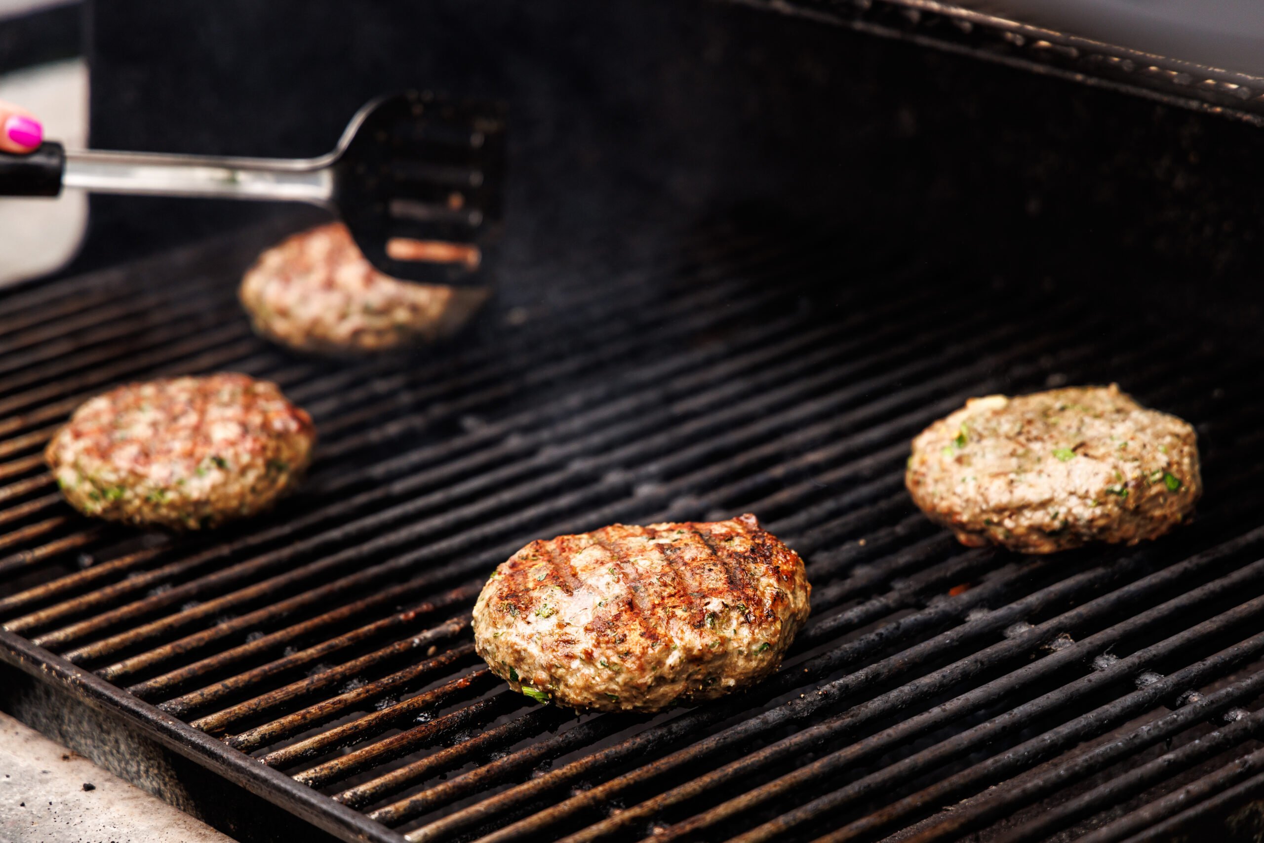 Grilling Greek lamb burgers.