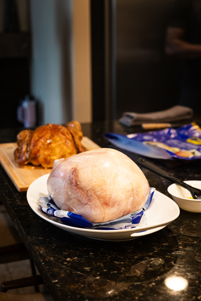 Frozen turkey unwrapped on a plate.